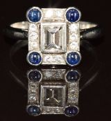 A platinum ring set with an emerald cut diamond of approximately 0.35ct surrounded by diamonds and