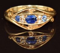 An 18ct gold ring set with three spinel and four diamonds, Birmingham 1918, 3.1g, size N