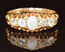 Victorian 18ct gold ring set with an opal cabochon and four old cut diamonds, 4.8g, size N