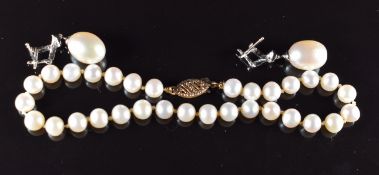 A pair of 18ct white gold earrings set with a freshwater pearl and diamonds (4.3g) and a pearl