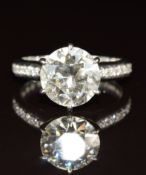 An 18ct white gold ring set with a round cut diamond of approximately 2.8ct, with diamond