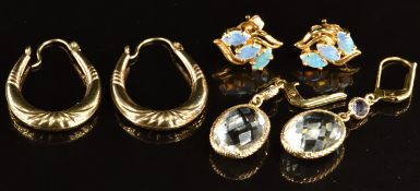 A pair of 18k gold earrings set with opals (2.7g) and two pairs of 9ct gold earrings, one pair set