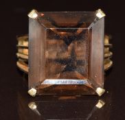 A 9ct gold ring set with an emerald cut smoky quartz, 9.5g, size O