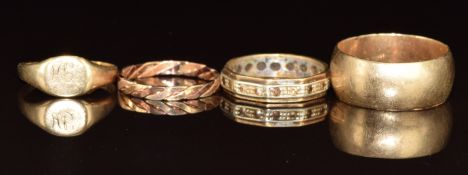 Four 9ct gold rings comprising a wedding band / ring, signet ring, plaited ring and a eternity ring,