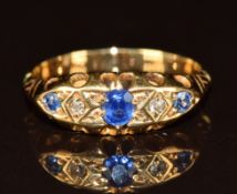 A c1920 yellow metal ring set with sapphires and diamonds, 2.7g, size M