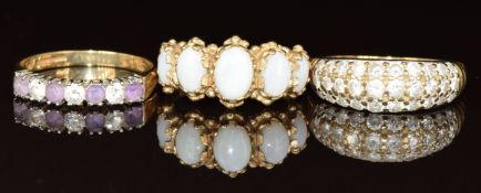 Three 9ct gold rings, one set with five opal cabochons, one cubic zirconia and the other amethysts