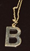 A 9ct gold 'B' pendant on 9ct gold chain, 2.8g