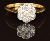 An 18ct gold ring set with diamonds in a platinum cluster, 2.2g, size L