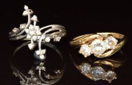A 9ct white gold ring set with diamonds in a floral cluster (size N) and a 9ct gold ring set with