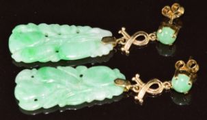 A pair of 9ct gold earrings set with carved jadeite, 5.5g, 4.8cm