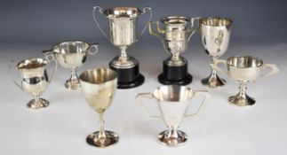 Five hallmarked silver twin handled trophies and a hallmarked silver goblet, mostly circa 1930s,