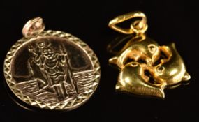 A 9ct gold St Christopher (1.7g) and 18ct gold pendant in the form of dolphins (2.3g)