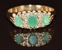 A 9ct gold ring set with emeralds and diamonds, 2.4g, size O