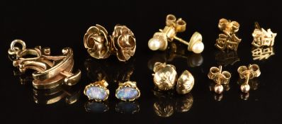 Five pairs of 9ct gold earrings, 9ct gold charm (7.3g) and a pair of 14k gold earrings (0.5g)