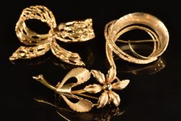 Three 9ct gold brooches, one in the form of a bow and one a flower, 11.6g