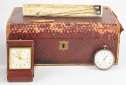 A silver pocket watch, three hatpins including two with white metal tops, travelling clock and