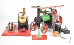 Mamod TE1A live steam model traction engine together with an SE3 stationary engine and grinding