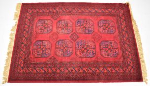 Turkoman rug with eight guls on a wine ground, 210 x 140cm