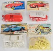 Four Airfix 1:32 scale plastic model classic car and motorcycle kits comprising Jaguar E Type M5C
