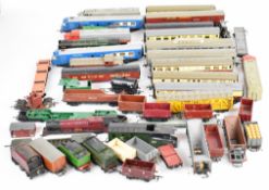A collection of Tri-Ang 00 gauge model railway engines and carriages.