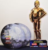 Two Star Wars/Tazos promotional cardboard cut-out standees comprising C-3PO and The Deathstar,