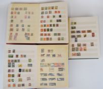 Three large stamp stockbooks containing world stamps mint and used