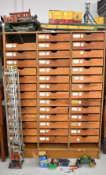 Forty-one drawer haberdashery shopfitting cabinet housing a large collection of Meccano parts and