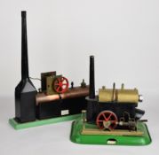Two likely scratch built live steam stationary engines comprising one with geared single cylinder