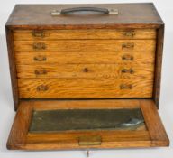 Collector's or toolmaker's chest with C.Q.R branded handles decal to top and five drawers within,