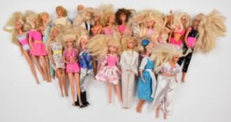 Twenty Mattel Barbie dolls dressed in a range of evening, sports and casual clothing.