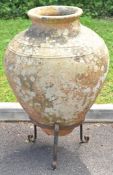 Large Grecian style terracotta urn on metal base, height 100m