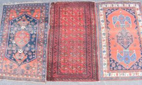 Turkoman rug with thirty three guls and multiple geometric borders on wine ground (196 x 113cm)