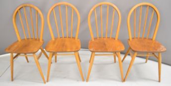 Four Ercol light elm dining chairs