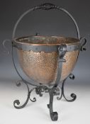 Arts & Crafts style hammered copper and wrought iron log basket, height 58cm