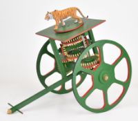 Novelty model of a Chinese carriage surmounted by a tiger on a platform, built by the award