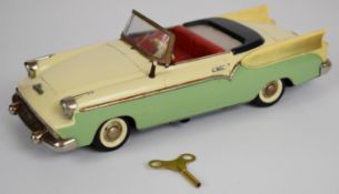 Schuco Elektro-Radio tinplate model car with mint green/cream body, red interior and chrome trim,