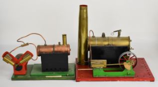Two likely scratch built live steam stationary engines comprising one with large single cylinder