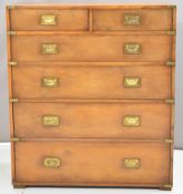 Campaign style yew chest of two over four graduated drawers. Vendor advises the chest was
