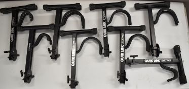 Eight Quik Lok Systems guitar stands, most appear unused