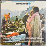 Woodstock triple LP Atlantic 2402-001/002/003 (2663-001) red / plum labels, top opening trifold