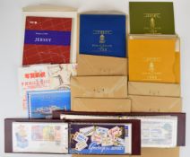 A collection of Jersey presentation packs and first day covers in twenty small folders, together