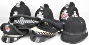 Four police helmets for South Wales Police and one unbadged, together with four peaked caps (8)