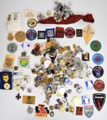 Large collection of cloth and metal badges including Police, Fire Brigade, enamelled Elk / Moose,
