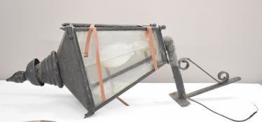 A 19th / 20thC glazed street lamp with wall bracket, height including bracket 135cm