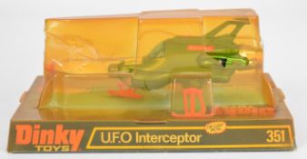 Dinky Toys diecast model UFO Interceptor ship with metallic green body, orange feet and missile,
