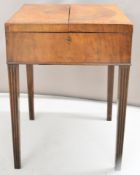19thC mahogany campaign style table with fold out tray flaps and fitted interior, raised on reeded