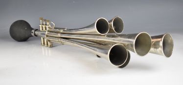 Eight note bulb or trumpet horn with three valves, each trumpet marked with the note, of vintage,
