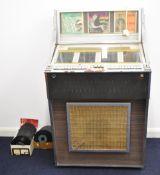 Juke box with approximately one hundred Rock n Roll 45s,