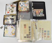 A large collection of mostly used GB and world stamps and first day covers in stockbooks, bags and