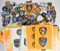 Approximately two hundred overseas police cloth and metal badges including Uganda, Royal Hong